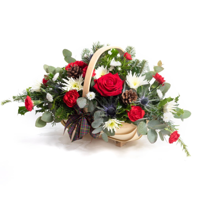 Basket Of Joy - This collection of beautiful flowers and seasonal foliage are expertly arranged in a beautiful basket for the perfect Christmas gift.